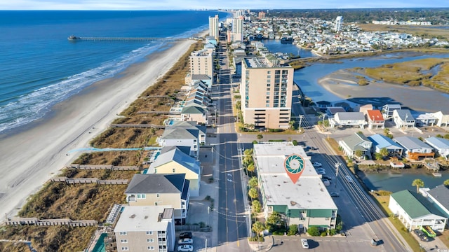 aerial view featuring a view of the beach and a water view