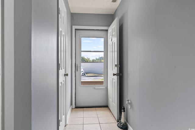 entryway featuring light tile patterned floors