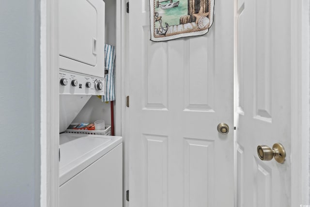 laundry area with stacked washer and dryer