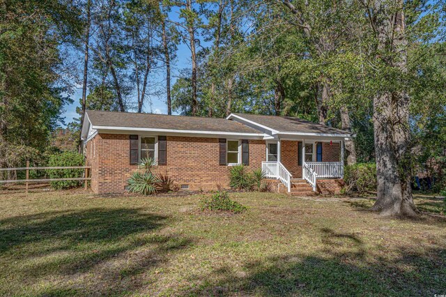 view of front of home featuring a front lawn and covered porch