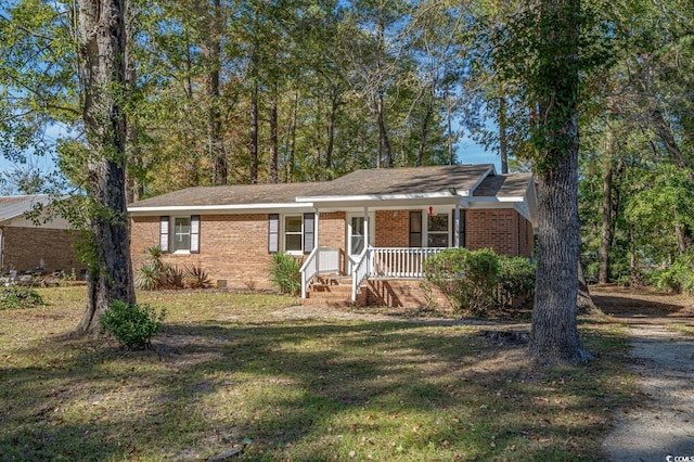 single story home featuring a front lawn