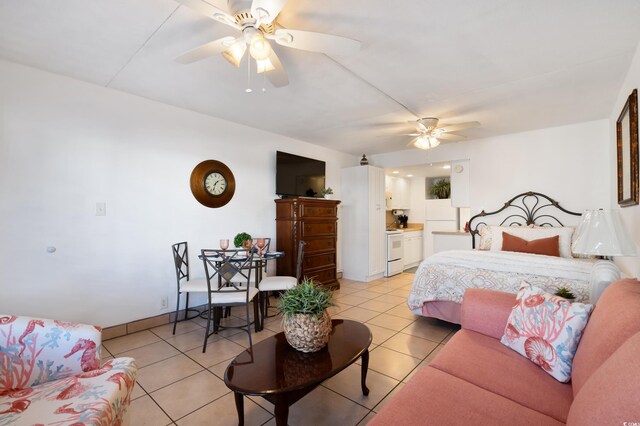 tiled bedroom with ceiling fan