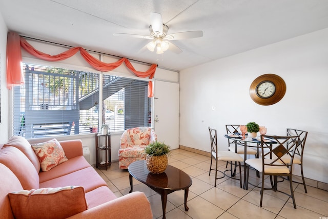 tiled living room with ceiling fan