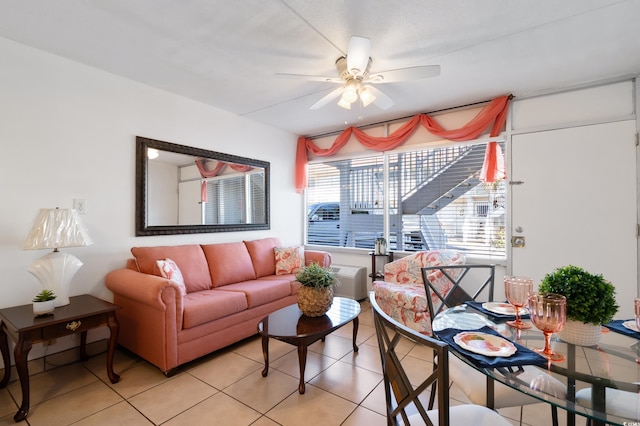 tiled living room featuring ceiling fan