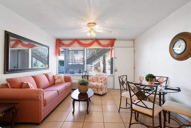 tiled living room featuring ceiling fan