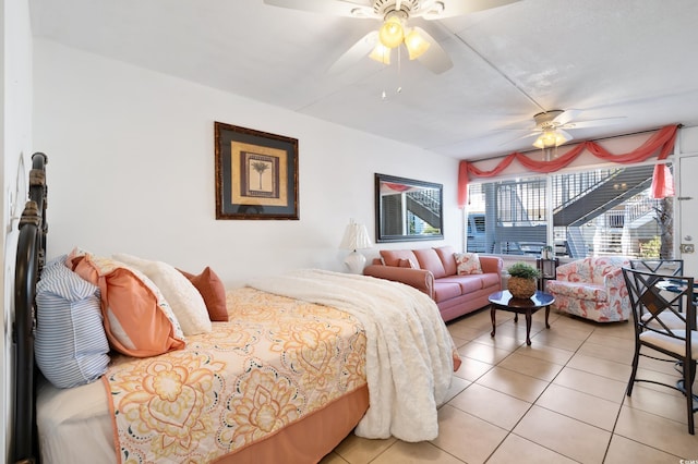 bedroom featuring light tile patterned floors and ceiling fan