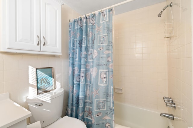 full bathroom featuring vanity, toilet, shower / bathtub combination with curtain, and tile walls