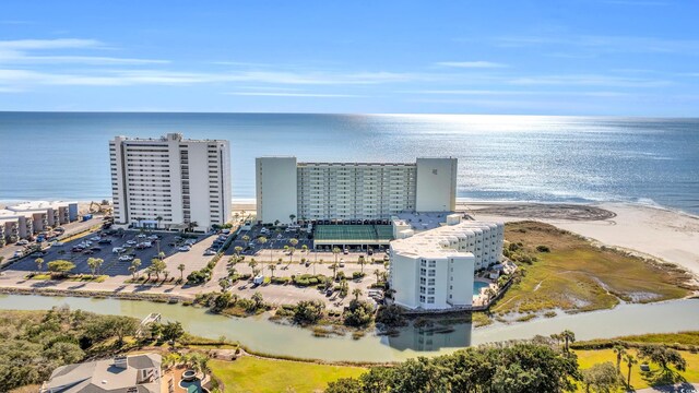 bird's eye view featuring a beach view and a water view