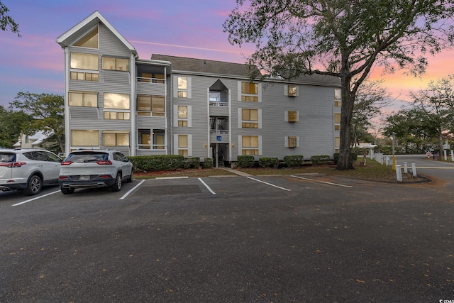 view of outdoor building at dusk