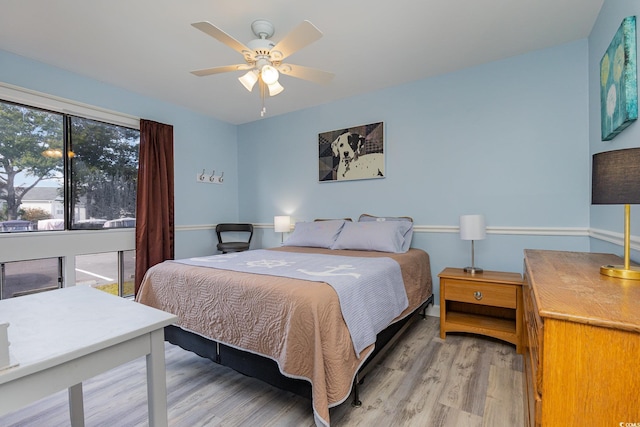 bedroom featuring hardwood / wood-style floors and ceiling fan