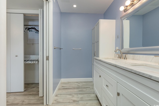 bathroom featuring vanity and wood-type flooring