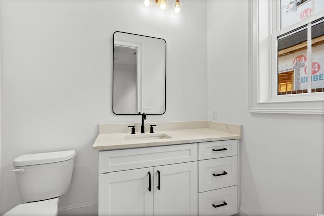 bathroom with vanity and toilet