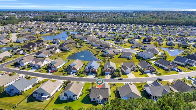 drone / aerial view with a water view