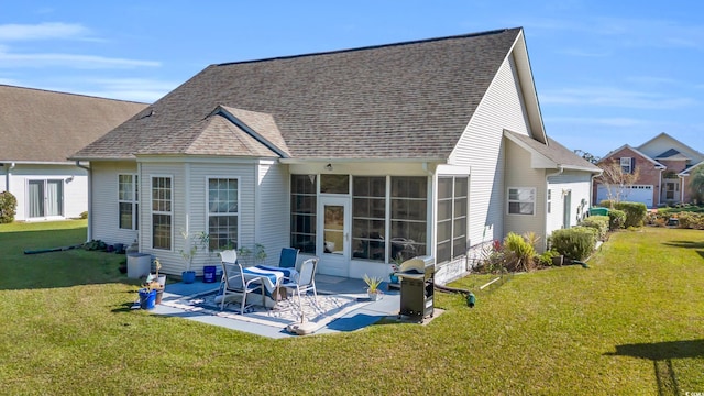 back of property featuring a patio area and a yard