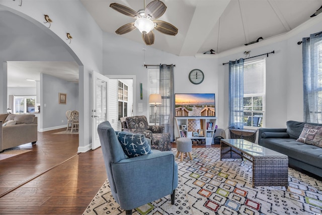 living room with vaulted ceiling, ceiling fan, and dark hardwood / wood-style floors