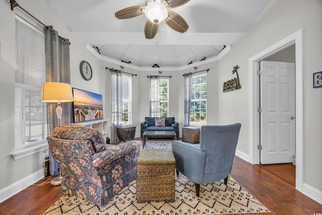 living room with ceiling fan, wood-type flooring, and crown molding