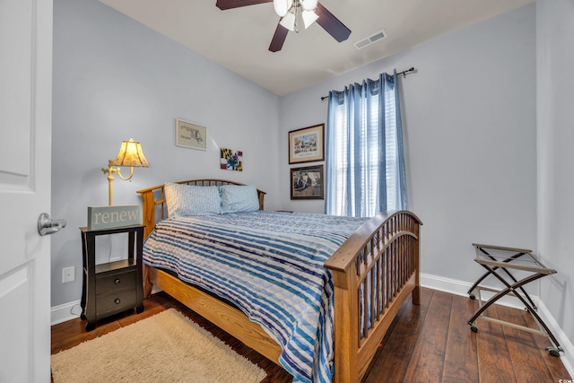 bedroom with ceiling fan and dark hardwood / wood-style floors