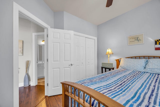 bedroom featuring hardwood / wood-style flooring, ceiling fan, and a closet