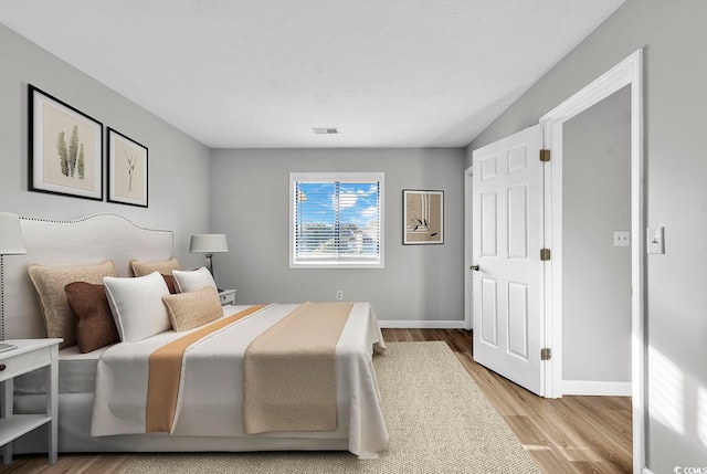 bedroom with light hardwood / wood-style flooring