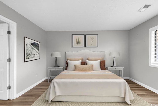 bedroom featuring wood-type flooring