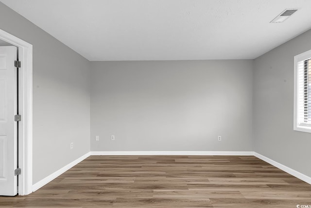 spare room featuring hardwood / wood-style floors