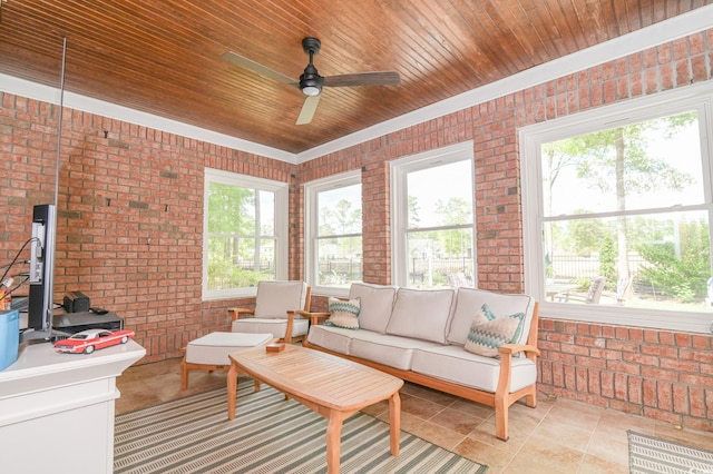 sunroom with ceiling fan, a healthy amount of sunlight, and wood ceiling