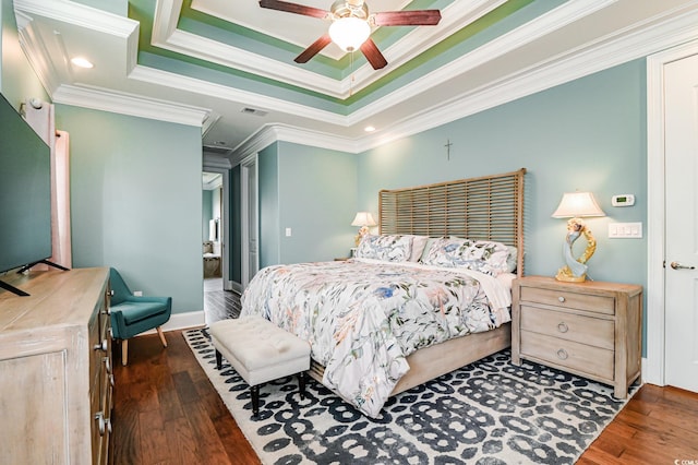 bedroom featuring a raised ceiling, ceiling fan, crown molding, and dark wood-type flooring