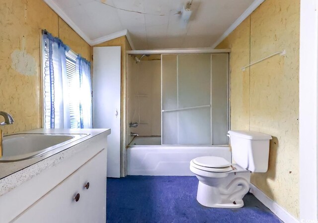 full bathroom featuring vanity, bath / shower combo with glass door, ornamental molding, and toilet