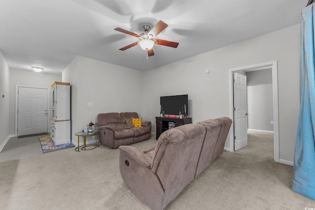 living room featuring light carpet and ceiling fan