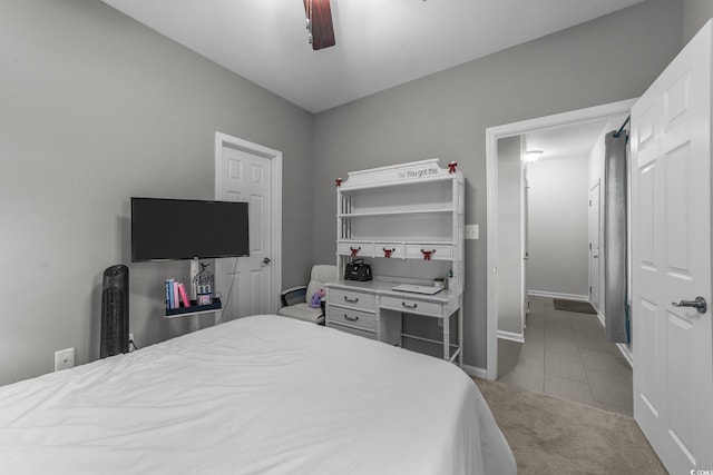 bedroom with ceiling fan and light carpet