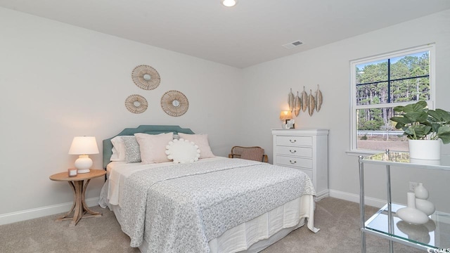 bedroom with light colored carpet