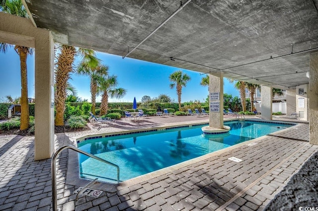 view of swimming pool featuring a patio