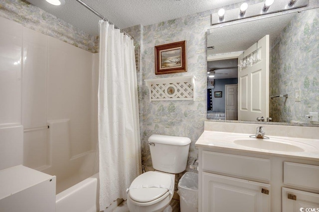 full bathroom with shower / tub combo, vanity, a textured ceiling, ceiling fan, and toilet