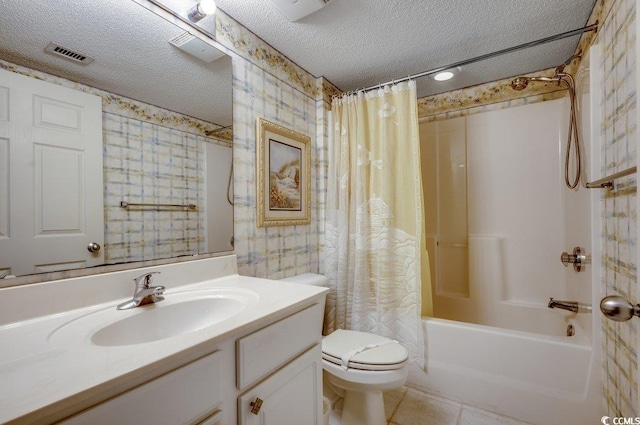 full bathroom with shower / bath combo, vanity, tile patterned flooring, toilet, and a textured ceiling