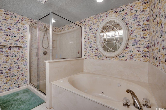 bathroom with separate shower and tub and a textured ceiling