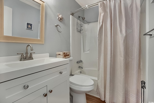 full bathroom featuring hardwood / wood-style floors, vanity, toilet, and shower / bathtub combination with curtain