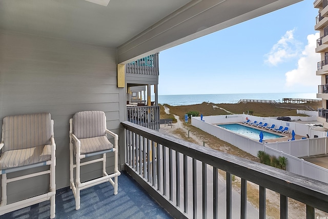 balcony featuring a water view