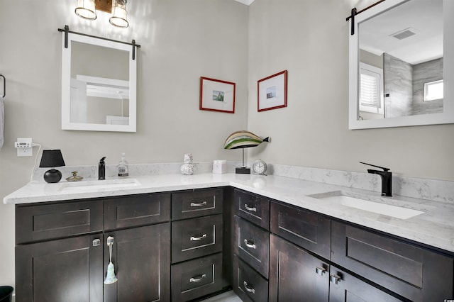 bathroom featuring visible vents and vanity
