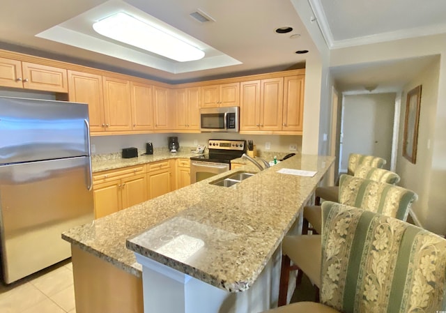 9994 Beach Club Dr Unit 1806, Myrtle Beach, SC 29572 - kitchen featuring stainless steel appliances, a sink, a breakfast bar area, crown molding, and light stone counters