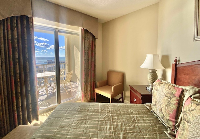 9994 Beach Club Dr Unit 1806, Myrtle Beach, SC 29572 - bedroom featuring access to outside, baseboards, and a water view