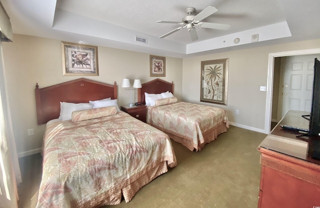 9994 Beach Club Dr Unit 1806, Myrtle Beach, SC 29572 - carpeted bedroom with a tray ceiling, baseboards, and a ceiling fan