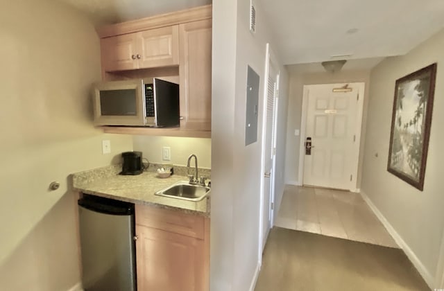 9994 Beach Club Dr Unit 1806, Myrtle Beach, SC 29572 - kitchen featuring stainless steel microwave, a sink, electric panel, baseboards, and dark wood-style floors