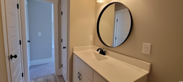 bathroom featuring wood-type flooring and vanity