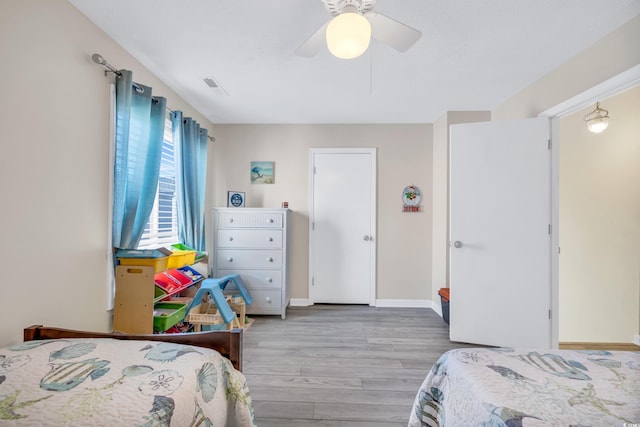 bedroom featuring ceiling fan and light hardwood / wood-style floors