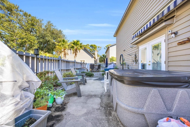 view of patio with a hot tub