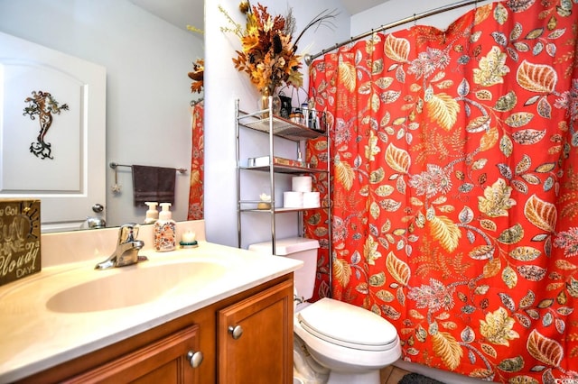 bathroom with vanity and toilet