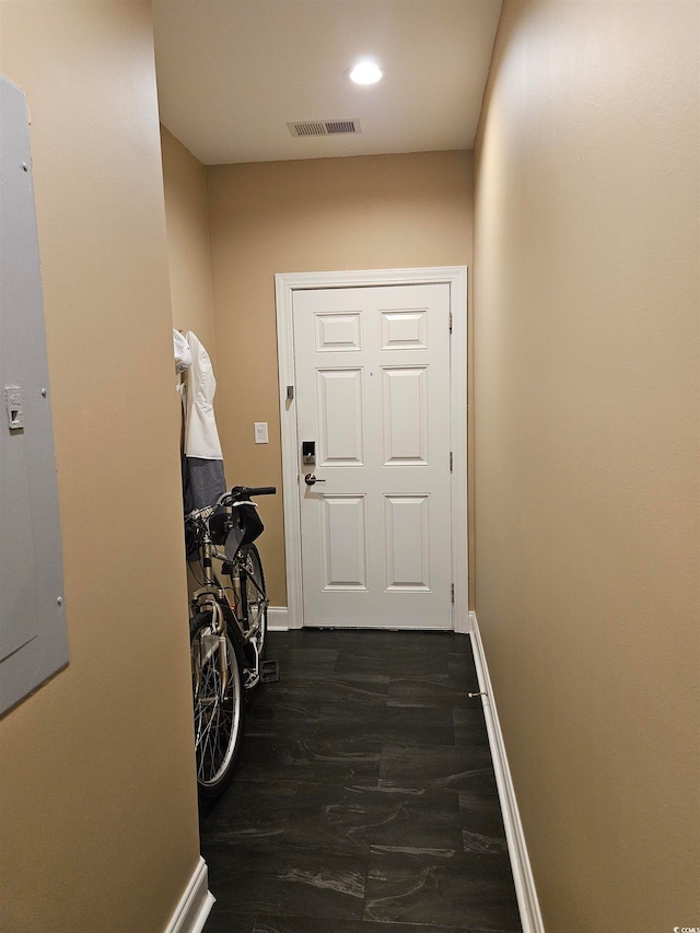 doorway to outside with dark wood-type flooring