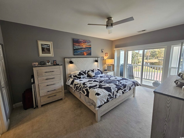 carpeted bedroom featuring access to exterior and ceiling fan