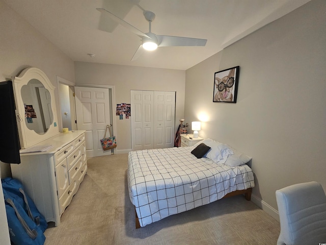 bedroom with ceiling fan and light colored carpet