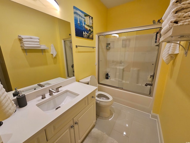 full bathroom featuring shower / bath combination with glass door, tile patterned flooring, vanity, and toilet